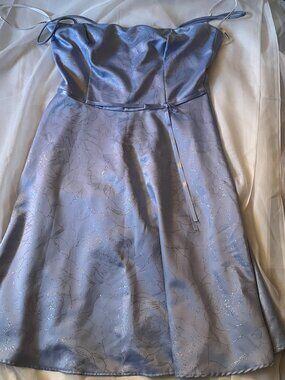 Beautiful Bleu Dress with Glitters, and a bow at the waist size 13 from Rampage.